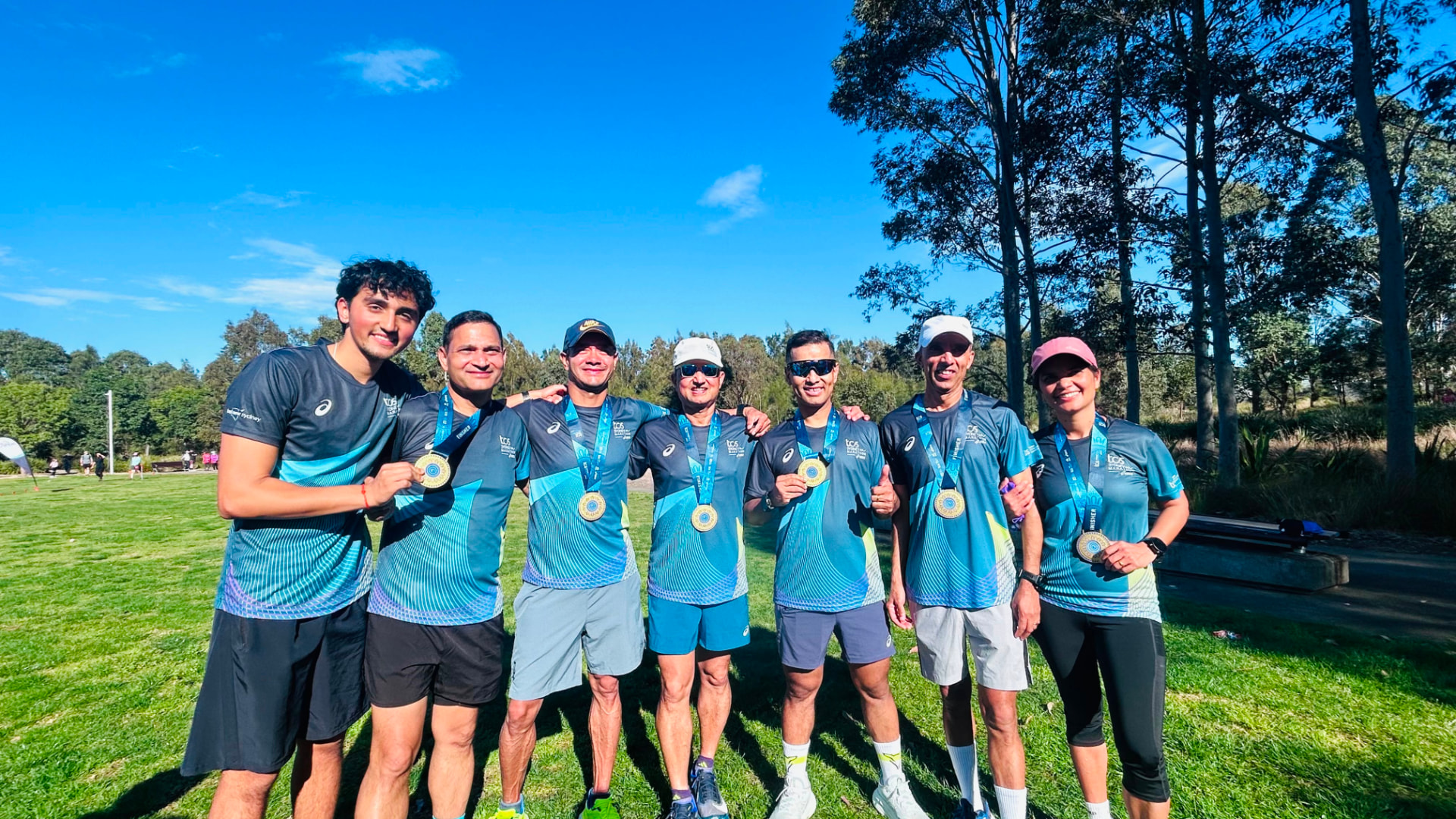 NRA finishers showing their Sydney Marathon medals